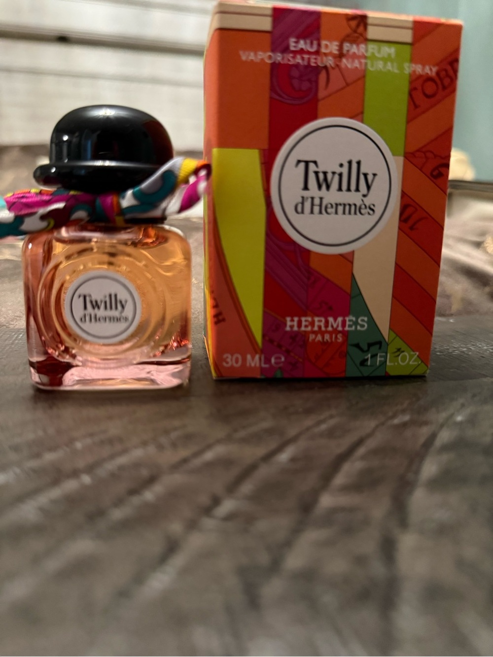 Coach pink-tinted perfume bottle with black cap